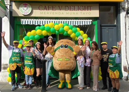 Cafe V Delight grand opening with Potato Corner mascot and staff celebrating together.